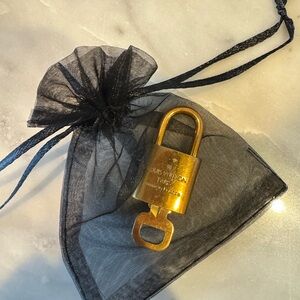 Louis Vuitton Gold Lock and Key